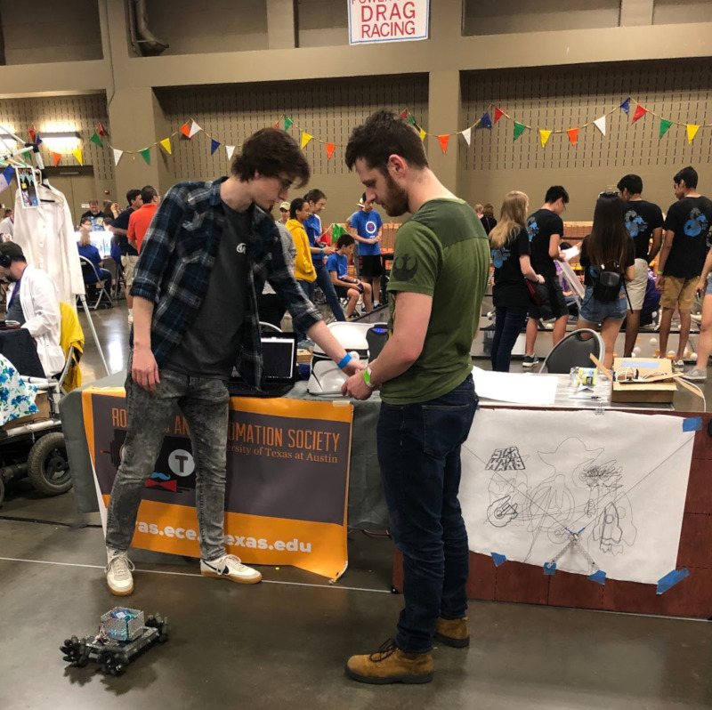 Showing off the polargraph and other robots at the MakerFaire